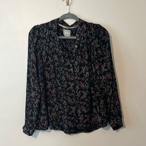 ANTHROPOLOGIE black floral blouse.